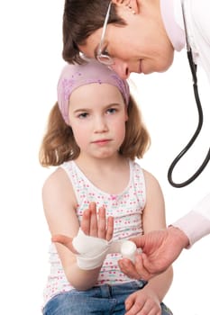 Toddler at pediatrician in front of white background