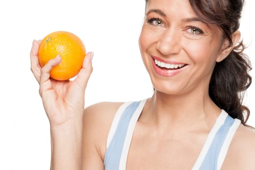 Smiling woman in front of white background with an orange