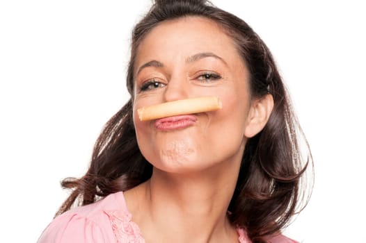 Smiling woman with a biscuit against a white background