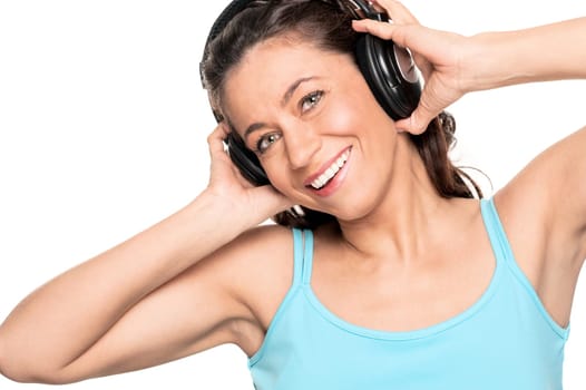 Smiling woman with a headphone against a white background