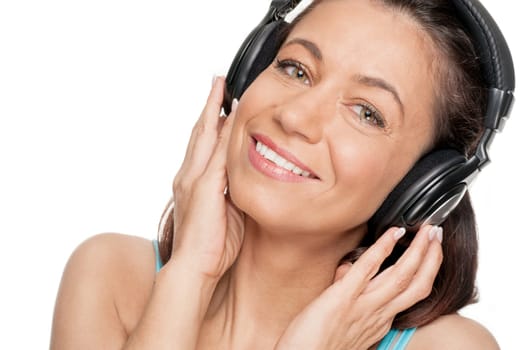 Smiling woman with a headphone against a white background