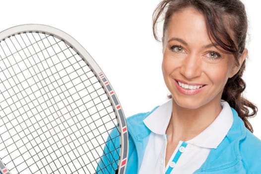 Sporty woman with a tennis racket in front of a white background