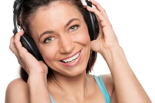 Smiling woman with a headphone against a white background