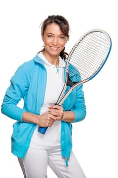 Sporty woman with a tennis racket in front of a white background