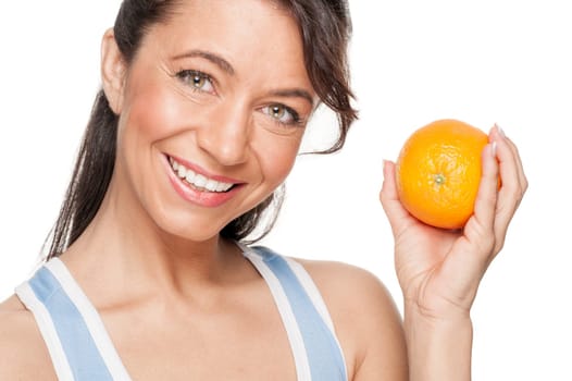 Smiling woman in front of white background with an orange