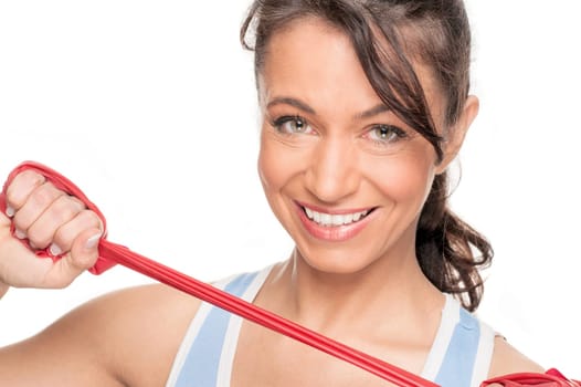 Sporty woman with a red gymnastics ribbon in front of a white background