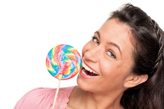 Smiling woman with a lollipop against a white background