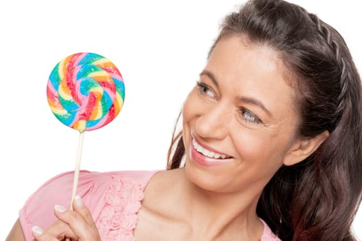 Smiling woman with a lollipop against a white background