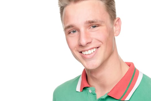Smiling young man in front of white background
