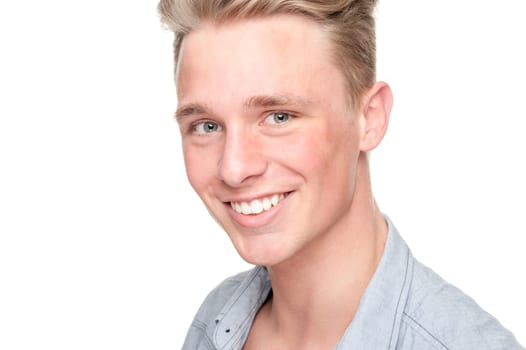 Smiling young man in front of white background