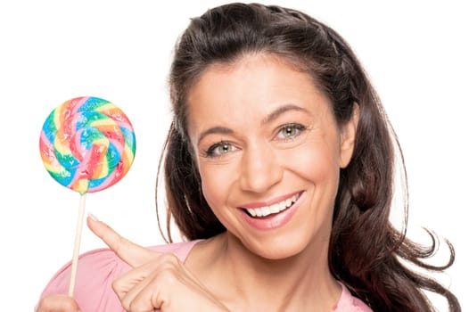 Smiling woman with a lollipop against a white background