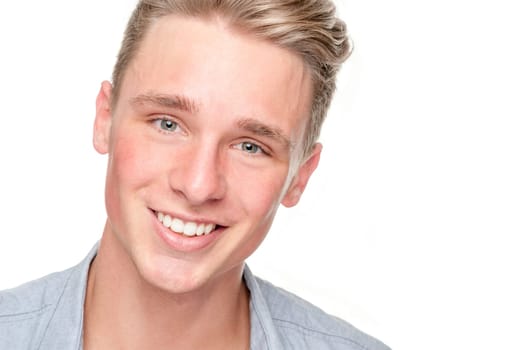 Smiling young man in front of white background
