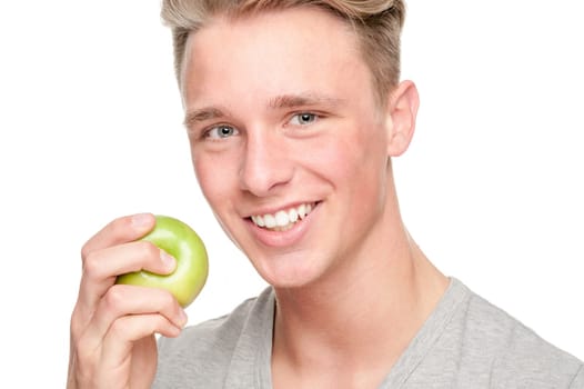 Young and smiling man with an apple