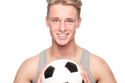 Young man with a soccer ball against a white background