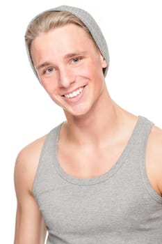 Smiling young man in front of white background