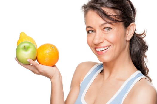 Smiling woman in front of white background with fruit