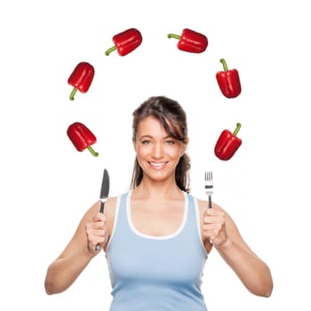 Smiling woman in front of white background with peppers