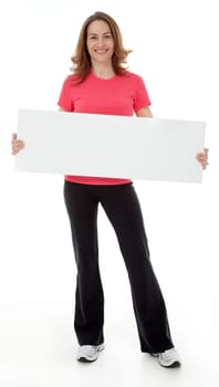 Attractive adult woman standing, holding blank sign, isolated on white.