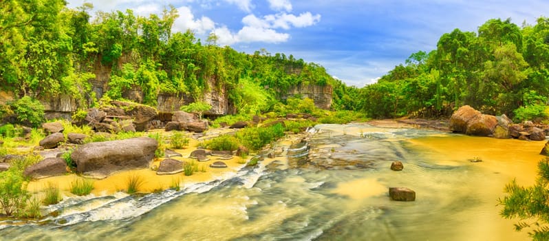 Jungle river at summer day in Vietnam. Panorama