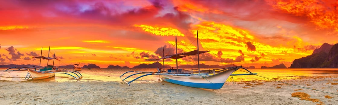 Traditional philippine boat bangka at sunset time