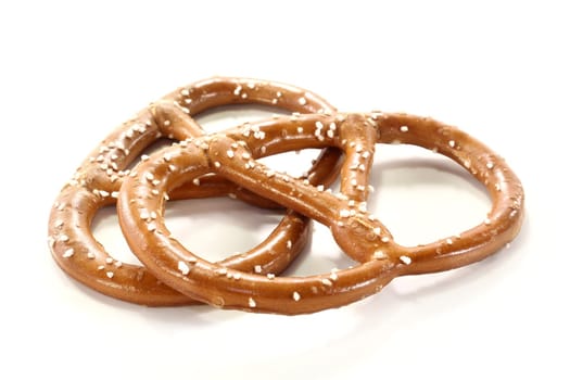Two pretzels against white background