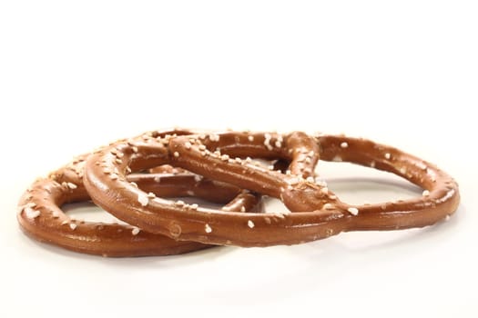 Two pretzels against white background