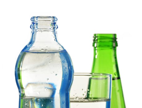 Glass bottle of mineral water isolated on white