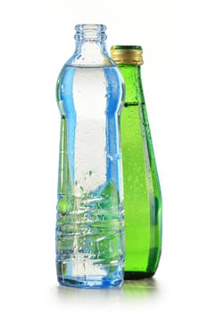 Glass bottle of mineral water isolated on white