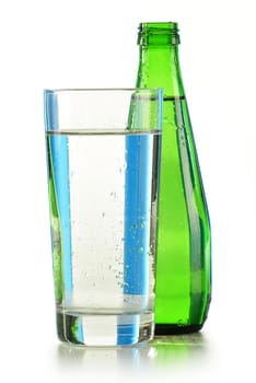 Glass bottle of mineral water isolated on white