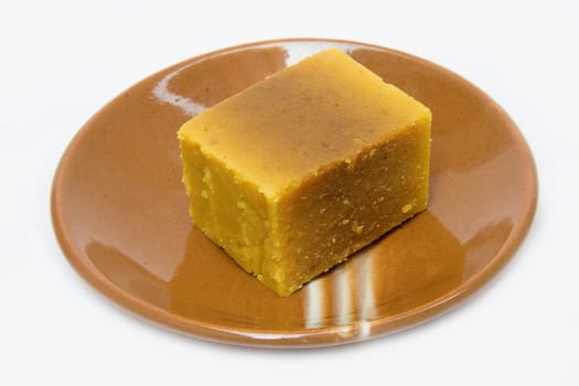 "Mysore Pak"" is a delicious sweet of Karnataka in South India with Bengal gram flour, sugar and ghee as ingredients"
