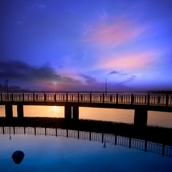 Sea stones at sunset with nice bridge