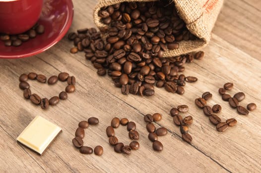 Grains of coffee on a wooden surface