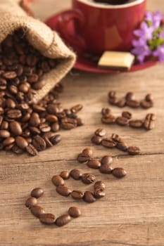 Grains of coffee on a wooden surface