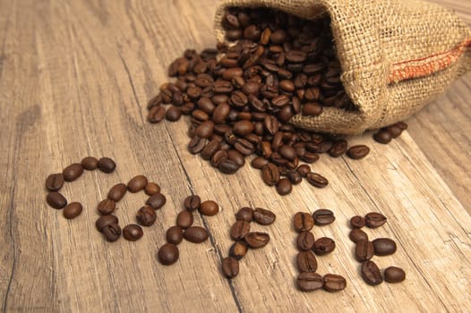 Grains of coffee on a wooden surface