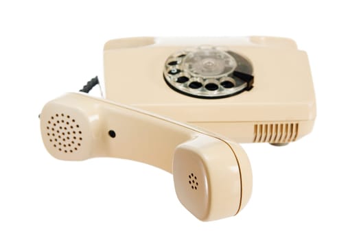 Old analog phone with a disk, it is isolated on white