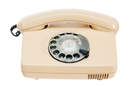 Old analog phone with a disk, it is isolated on white