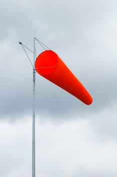 pointer to the direction and strength of wind against the background of the sky