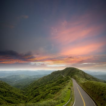 Green road with blue sky best for car adv use