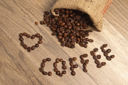 Grains of coffee on a wooden surface