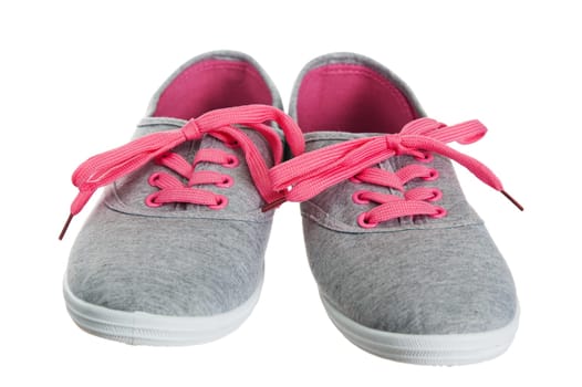 Beautiful female pink sneakers, it is isolated on white