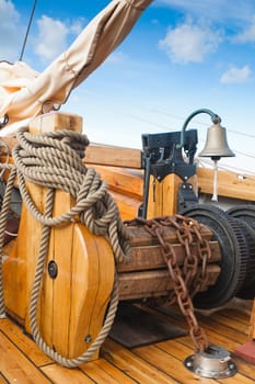ship's Bell and anchor lifting mechanism on an old sailboat