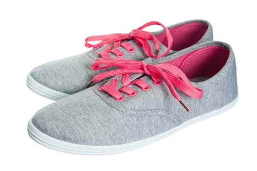 Beautiful female pink sneakers, it is isolated on white