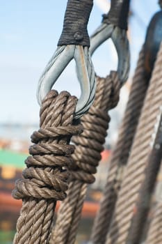 Ancient wooden sailboat pulleys and ropes detail