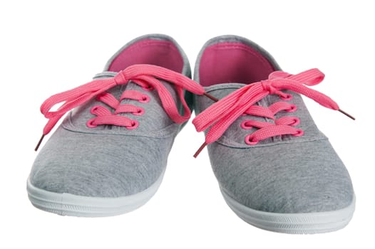 Beautiful female pink sneakers, it is isolated on white