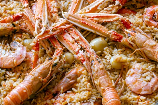 traditional spanish paella with prawn on big pan