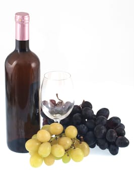 Red wine bottle, glass and grapes
