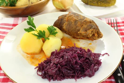 braised beef roulade with potatoes and red cabbage