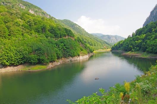 Summer lake in the mountains, in Romania