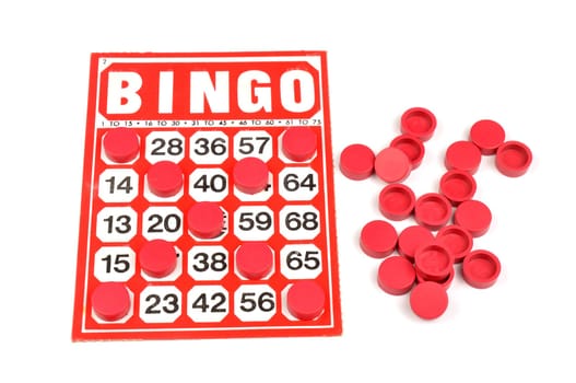 Red bingo card with winning chips