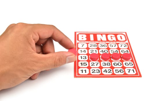 bingo card with hand hold winning chips